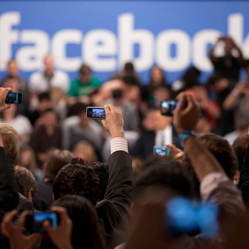 Facebook words background with hands